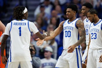 Mar 7, 2026; Lexington, Kentucky, USA; Kentucky Wildcats guard Otega Oweh (00) fives guard Denzel Aberdeen (1) during the first half against the Florida Gators at Rupp Arena at Central Bank Center. Mandatory Credit: Jordan Prather-Imagn Images