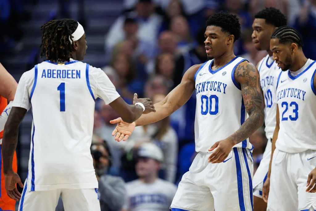 Mar 7, 2026; Lexington, Kentucky, USA; Kentucky Wildcats guard Otega Oweh (00) fives guard Denzel Aberdeen (1) during the first half against the Florida Gators at Rupp Arena at Central Bank Center. Mandatory Credit: Jordan Prather-Imagn Images