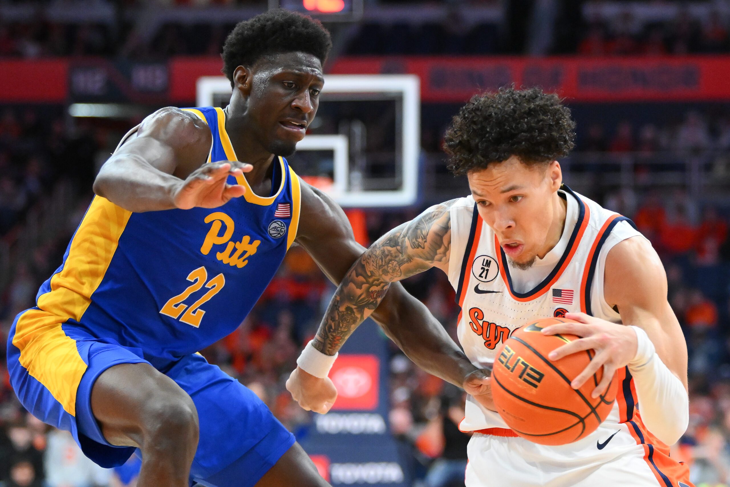 Mar 7, 2026; Syracuse, New York, USA; Syracuse Orange guard Nate Kingz (4) drives against Pittsburgh Panthers guard Barry Dunning Jr. (22) during the second half at the JMA Wireless Dome. Mandatory Credit: Rich Barnes-Imagn Images