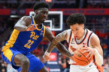 Mar 7, 2026; Syracuse, New York, USA; Syracuse Orange guard Nate Kingz (4) drives against Pittsburgh Panthers guard Barry Dunning Jr. (22) during the second half at the JMA Wireless Dome. Mandatory Credit: Rich Barnes-Imagn Images