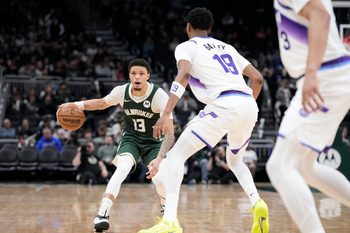 Mar 7, 2026; Milwaukee, Wisconsin, USA; Milwaukee Bucks guard Ryan Rollins (13) brings the ball up court against Utah Jazz forward Ace Bailey (19) in the second half at Fiserv Forum. Mandatory Credit: Michael McLoone-Imagn Images