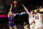 Mar 7, 2026; Minneapolis, Minnesota, USA; Northwestern Wildcats forward Nick Martinelli (2) shoots over Minnesota Golden Gophers forward Grayson Grove (2) during the second half at Williams Arena. Mandatory Credit: Matt Krohn-Imagn Images