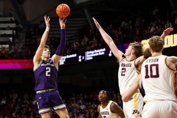 Mar 7, 2026; Minneapolis, Minnesota, USA; Northwestern Wildcats forward Nick Martinelli (2) shoots over Minnesota Golden Gophers forward Grayson Grove (2) during the second half at Williams Arena. Mandatory Credit: Matt Krohn-Imagn Images