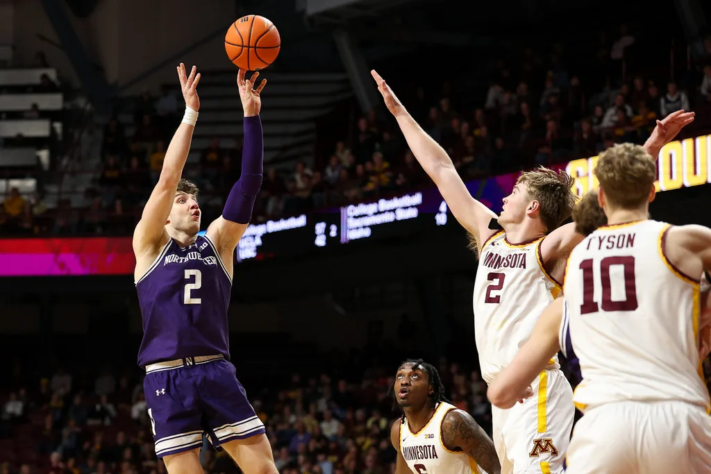 Mar 7, 2026; Minneapolis, Minnesota, USA; Northwestern Wildcats forward Nick Martinelli (2) shoots over Minnesota Golden Gophers forward Grayson Grove (2) during the second half at Williams Arena. Mandatory Credit: Matt Krohn-Imagn Images