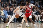 Mar 7, 2026; Memphis, Tennessee, USA; Memphis Grizzlies guard Ty Jerome (2) dribbles as Los Angeles Clippers forward Derrick Jones Jr. (5) defends during the fourth quarter at FedExForum. Mandatory Credit: Petre Thomas-Imagn Images
