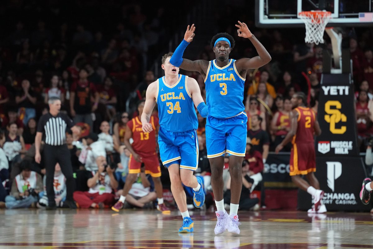 Mar 7, 2026; Los Angeles, California, USA; UCLA Bruins forward Eric Dailey Jr. (3) and forward Tyler Bilodeau (34) celebrate against the Southern California Trojans in the second half  at Galen Center. Mandatory Credit: Kirby Lee-Imagn Images