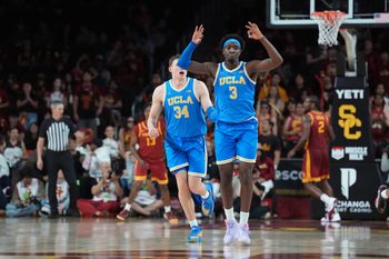 Mar 7, 2026; Los Angeles, California, USA; UCLA Bruins forward Eric Dailey Jr. (3) and forward Tyler Bilodeau (34) celebrate against the Southern California Trojans in the second half  at Galen Center. Mandatory Credit: Kirby Lee-Imagn Images