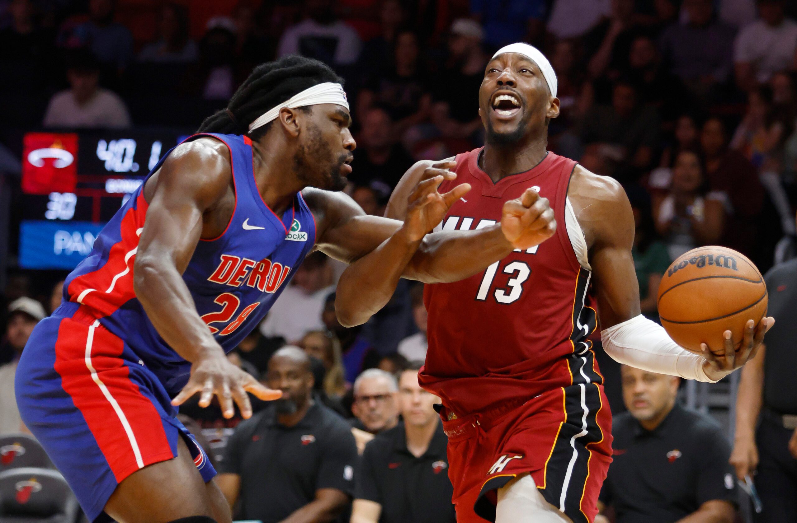 Mar 8, 2026; Miami, Florida, USA;  Detroit Pistons forward Isaiah Stewart (28) fouls Miami Heat center Bam Adebayo (13) during the first half at Kaseya Center. Mandatory Credit: Rhona Wise-Imagn Images