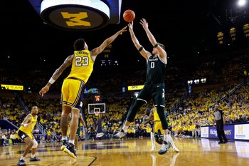Mar 8, 2026; Ann Arbor, Michigan, USA;  Michigan State Spartans forward Jaxon Kohler (0) shoots on Michigan Wolverines forward Yaxel Lendeborg (23) in the second half at Crisler Center. Mandatory Credit: Rick Osentoski-Imagn Images