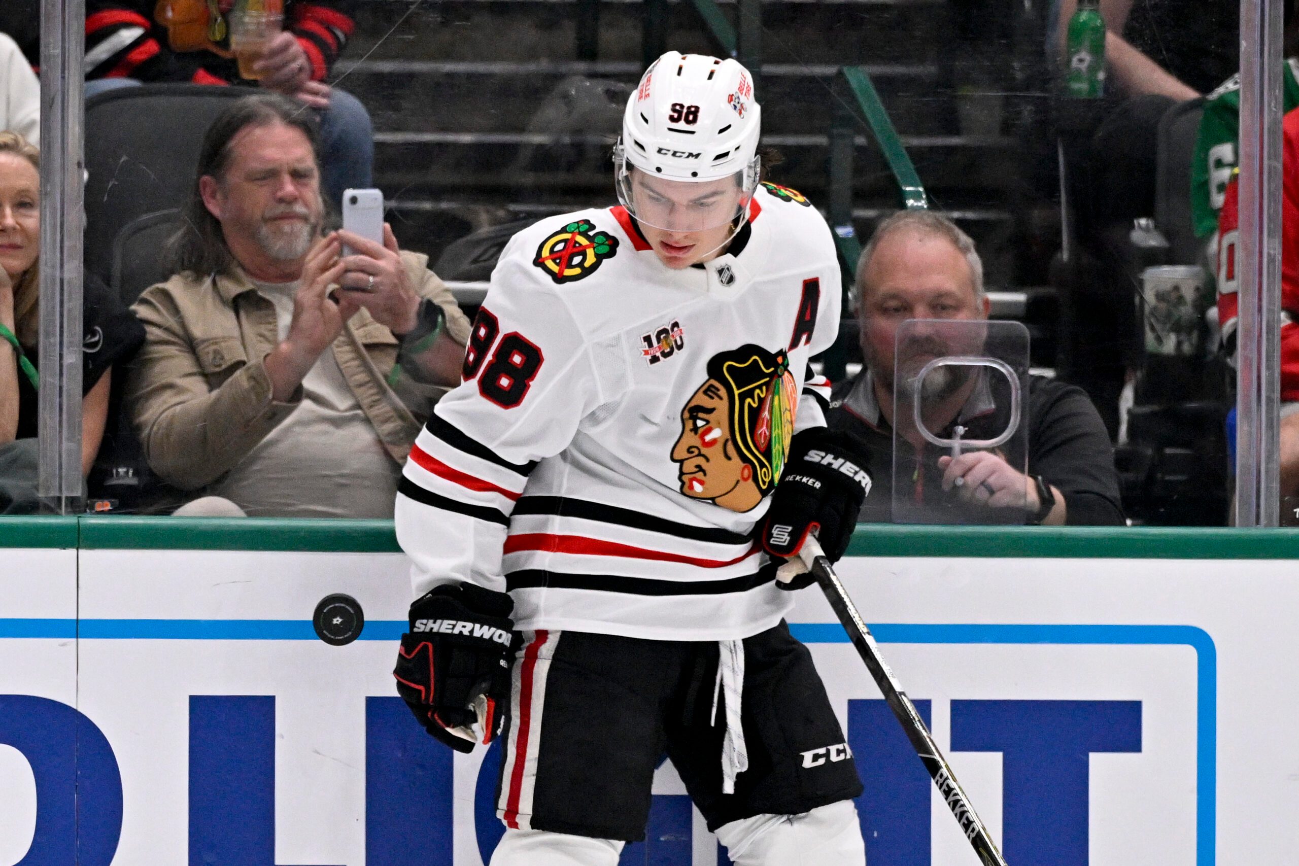 Mar 8, 2026; Dallas, Texas, USA; Chicago Blackhawks center Connor Bedard (98) keeps the puck in the Dallas Stars zone during the third period at the American Airlines Center. Mandatory Credit: Jerome Miron-Imagn Images