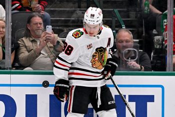 Mar 8, 2026; Dallas, Texas, USA; Chicago Blackhawks center Connor Bedard (98) keeps the puck in the Dallas Stars zone during the third period at the American Airlines Center. Mandatory Credit: Jerome Miron-Imagn Images