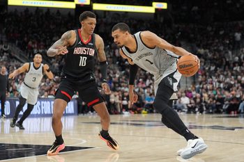 Mar 8, 2026; San Antonio, Texas, USA;  San Antonio Spurs forward Victor Wembanyama (1) dribbles against Houston Rockets forward Jabari Smith Jr. (10) in the second half at Frost Bank Center. Mandatory Credit: Daniel Dunn-Imagn Images