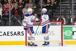Mar 8, 2026; Las Vegas, Nevada, USA; Edmonton Oilers right wing Kasperi Kapanen (42) celebrates with center Connor McDavid (97) after scoring an empty net goal against the Vegas Golden Knights during the third period at T-Mobile Arena. Mandatory Credit: Stephen R. Sylvanie-Imagn Images