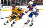 Mar 8, 2026; Las Vegas, Nevada, USA; Vegas Golden Knights center Jack Eichel (9) skates ahead of Edmonton Oilers defenseman Evan Bouchard (2) during the third period at T-Mobile Arena. Mandatory Credit: Stephen R. Sylvanie-Imagn Images