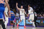 Mar 8, 2026; Los Angeles, California, USA; Los Angeles Lakers guard Luka Doncic (77) celebrates with forward Rui Hachimura (28) against the New York Knicks in the second half at Crypto.com Arena. Mandatory Credit: Kirby Lee-Imagn Images
