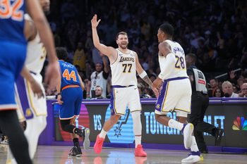 Mar 8, 2026; Los Angeles, California, USA; Los Angeles Lakers guard Luka Doncic (77) celebrates with forward Rui Hachimura (28) against the New York Knicks in the second half at Crypto.com Arena. Mandatory Credit: Kirby Lee-Imagn Images