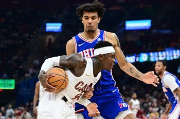 Mar 9, 2026; Cleveland, Ohio, USA; Cleveland Cavaliers guard Dennis Schroder (8) drives to the basket against Philadelphia 76ers forward Dominick Barlow (25) during the second half at Rocket Arena. Mandatory Credit: Ken Blaze-Imagn Images