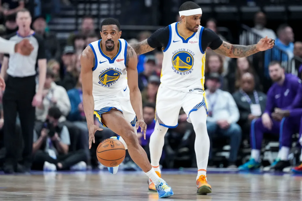 Mar 9, 2026; Salt Lake City, Utah, USA; Golden State Warriors guard De'Anthony Melton (8) dribbles down the court ahead of guard Gary Payton II (0) in the fourth quarter at Delta Center. Mandatory Credit: Gabriel Mayberry-Imagn Images