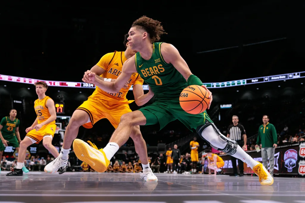 Mar 10, 2026; Kansas City, MO, USA; Baylor Bears guard Dan Skillings Jr. (0) drives during the second half against the Arizona State Sun Devils at T-Mobile Center. Mandatory Credit: William Purnell-Imagn Images