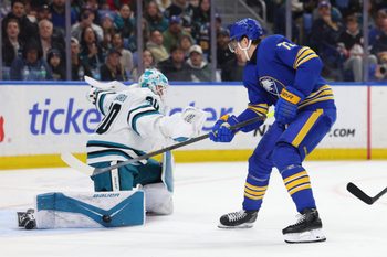 Mar 10, 2026; Buffalo, New York, USA;  San Jose Sharks goaltender Yaroslav Askarov (30) makes a pad save on Buffalo Sabres center Tage Thompson (72) during the second period at KeyBank Center. Mandatory Credit: Timothy T. Ludwig-Imagn Images