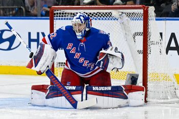 Mar 10, 2026; New York, New York, USA;  New York Rangers goaltender Jonathan Quick (32) makes a save against the Calgary Flames during the second period at Madison Square Garden. Mandatory Credit: Dennis Schneidler-Imagn Images