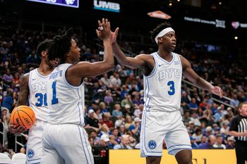 Mar 10, 2026; Kansas City, MO, USA; BYU Cougars forward AJ Dybantsa (3) slaps hands with BYU Cougars guard Robert Wright III (1) after a play during the second half against the Kansas State Wildcats at T-Mobile Center. Mandatory Credit: William Purnell-Imagn Images
