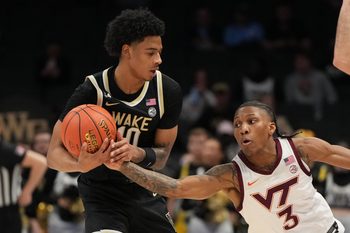 Mar 10, 2026; Charlotte, NC, USA; Wake Forest Demon Deacons guard Sebastian Akins (10) with the ball as Virginia Tech Hokies guard Ben Hammond (3) defends in the second half at Spectrum Center. Mandatory Credit: Bob Donnan-Imagn Images