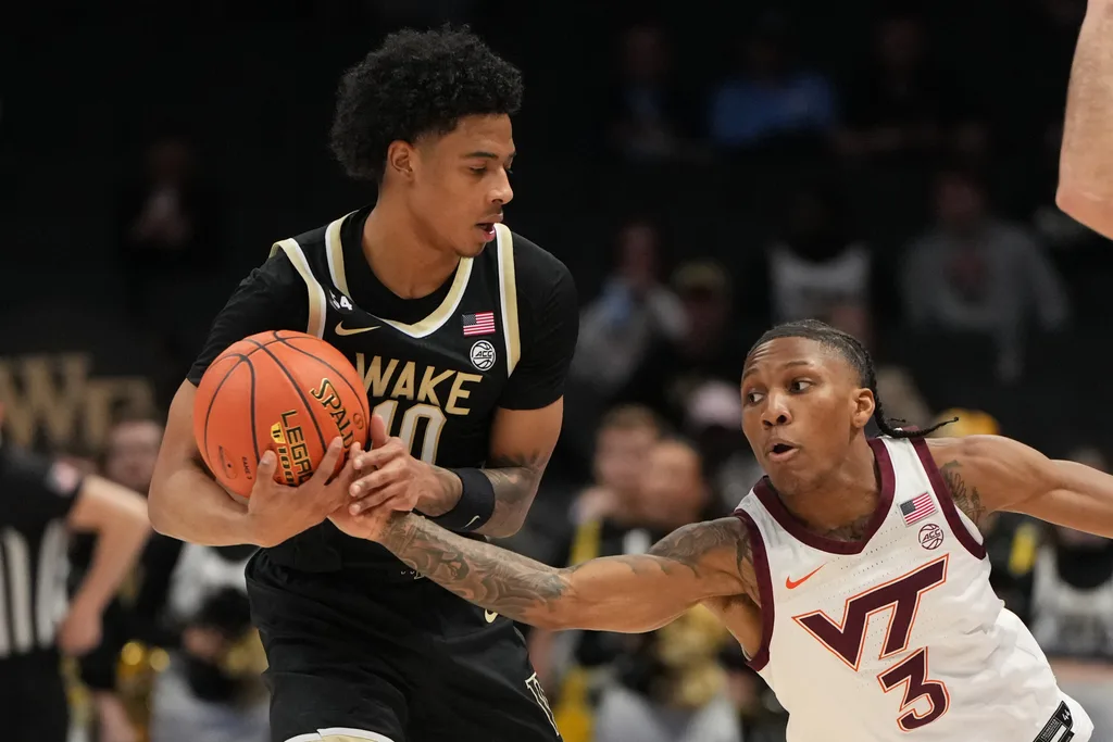 Mar 10, 2026; Charlotte, NC, USA; Wake Forest Demon Deacons guard Sebastian Akins (10) with the ball as Virginia Tech Hokies guard Ben Hammond (3) defends in the second half at Spectrum Center. Mandatory Credit: Bob Donnan-Imagn Images