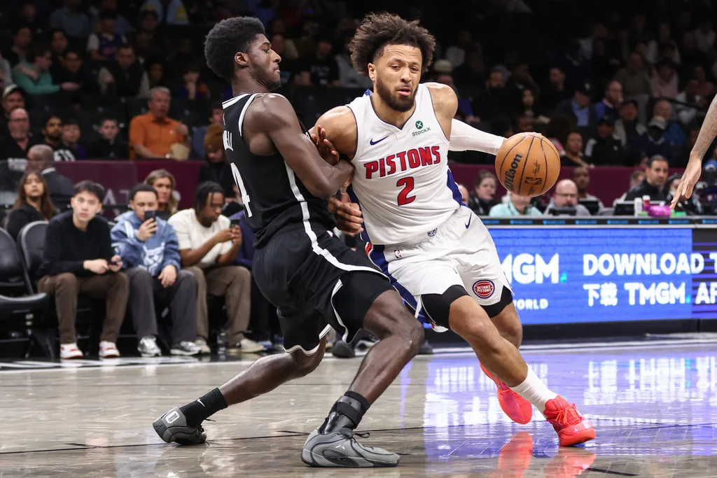 Mar 10, 2026; Brooklyn, New York, USA; Detroit Pistons guard Cade Cunningham (2) looks to drive past Brooklyn Nets guard Drake Powell (4) in the third quarter at Barclays Center. Mandatory Credit: Wendell Cruz-Imagn Images