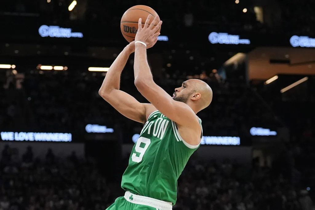 Mar 10, 2026; San Antonio, Texas, USA; Boston Celtics guard Derrick White (9) shoots the ball during the second half against the San Antonio Spurs at Frost Bank Center. Mandatory Credit: Daniel Dunn-Imagn Images