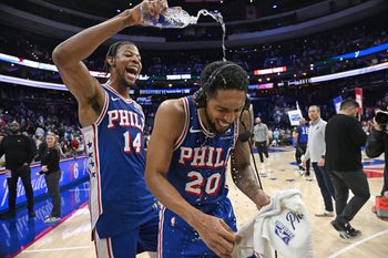 Mar 10, 2026; Philadelphia, Pennsylvania, USA; Philadelphia 76ers guard Cameron Payne (20) has water poured on him by forward Dalen Terry (14) after win against the Memphis Grizzlies at Xfinity Mobile Arena. Mandatory Credit: Eric Hartline-Imagn Images