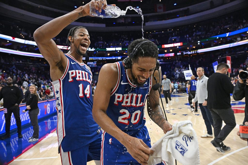 Mar 10, 2026; Philadelphia, Pennsylvania, USA; Philadelphia 76ers guard Cameron Payne (20) has water poured on him by forward Dalen Terry (14) after win against the Memphis Grizzlies at Xfinity Mobile Arena. Mandatory Credit: Eric Hartline-Imagn Images