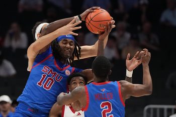 Mar 11, 2026; Charlotte, NC, USA; Southern Methodist University Mustangs center Jaden Toombs (10) passes to guard Boopie Miller (2) as Louisville Cardinals center Aly Khalifa (15) and guard Kobe Rodgers (11) defend in the second half at Spectrum Center. Mandatory Credit: Bob Donnan-Imagn Images