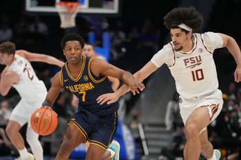 Mar 11, 2026; Charlotte, NC, USA; California Golden Bears guard Dai Dai Ames (7) with the ball as Florida State Seminoles guard Lajae Jones (10) defends in the first half at Spectrum Center. Mandatory Credit: Bob Donnan-Imagn Images