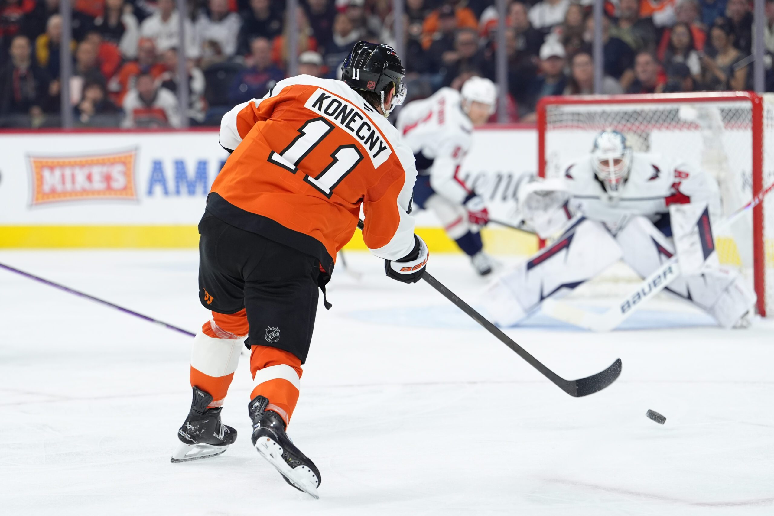 Mar 11, 2026; Philadelphia, Pennsylvania, USA; Philadelphia Flyers right wing Travis Konecny (11) shoots and scores a goal against the Washington Capitals in the second period at Xfinity Mobile Arena. Mandatory Credit: Kyle Ross-Imagn Images