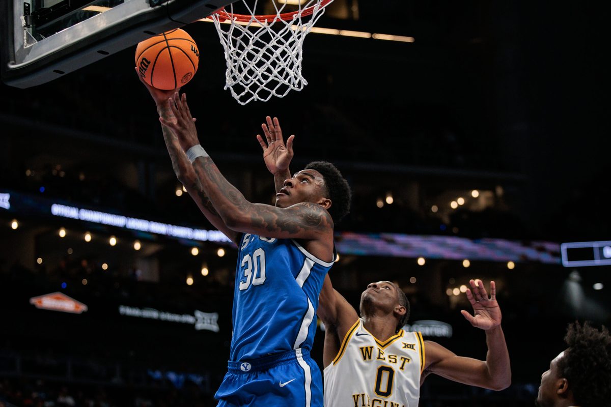Mar 11, 2026; Kansas City, MO, USA; BYU Cougars forward Kennard Davis Jr. (30) shoots the ball over West Virginia Mountaineers forward Brenen Lorient (0) during the second half at T-Mobile Center. Mandatory Credit: William Purnell-Imagn Images