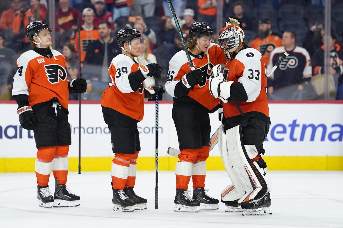 Mar 11, 2026; Philadelphia, Pennsylvania, USA; Philadelphia Flyers center Trevor Zegras (46) reacts with goalie Samuel Ersson (33) after the game against the Washington Capitals at Xfinity Mobile Arena. Mandatory Credit: Kyle Ross-Imagn Images