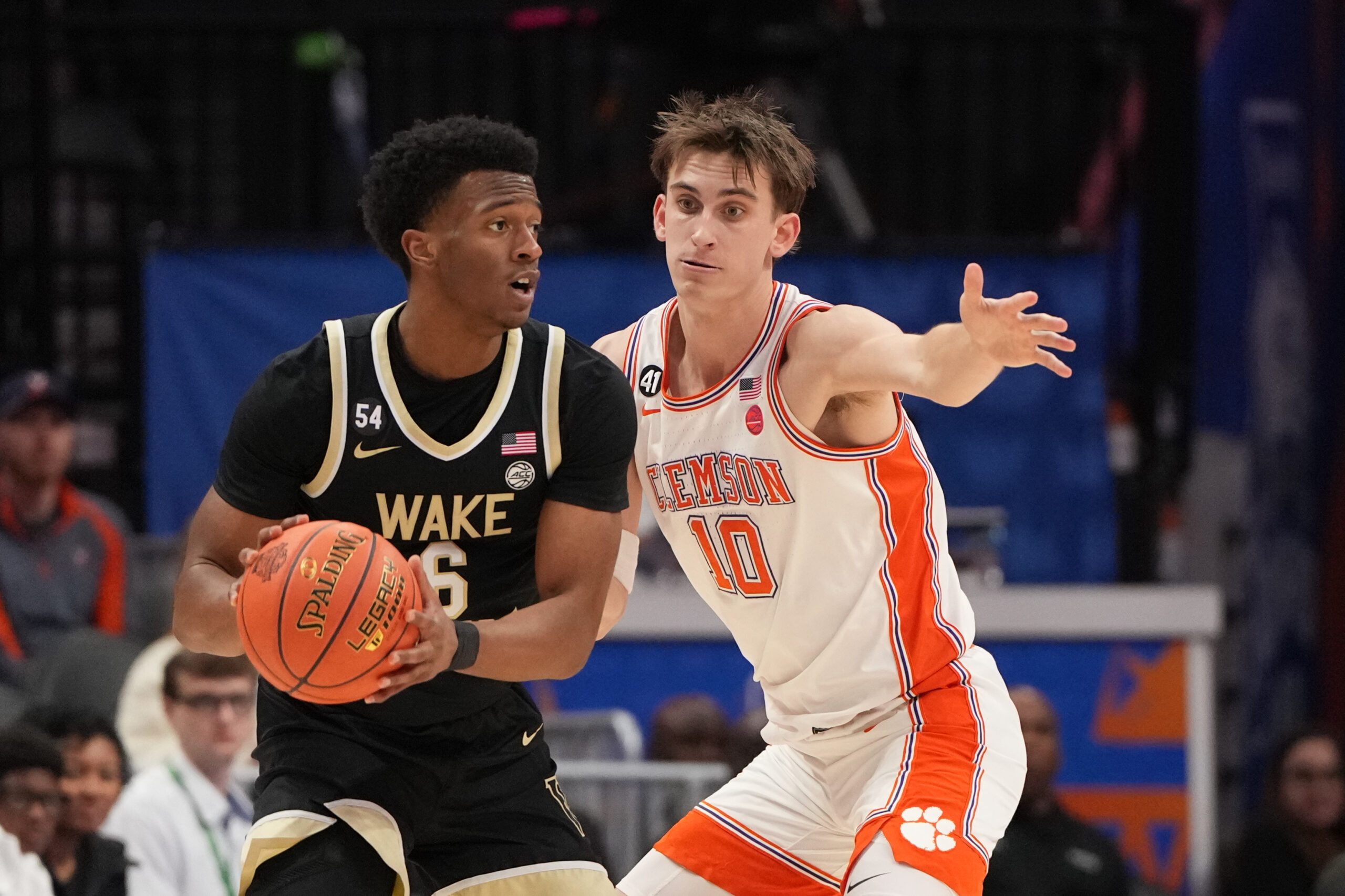 Mar 11, 2026; Charlotte, NC, USA; Wake Forest Demon Deacons guard Myles Colvin (6) with the ball as Clemson Tigers forward Jake Wahlin (10) defends in the second half at Spectrum Center. Mandatory Credit: Bob Donnan-Imagn Images