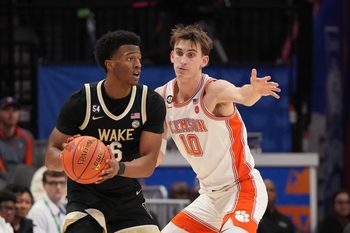 Mar 11, 2026; Charlotte, NC, USA; Wake Forest Demon Deacons guard Myles Colvin (6) with the ball as Clemson Tigers forward Jake Wahlin (10) defends in the second half at Spectrum Center. Mandatory Credit: Bob Donnan-Imagn Images