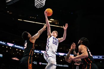 Mar 11, 2026; Kansas City, MO, USA; TCU Horned Frogs guard Tanner Toolson (55) shoots the ball over Oklahoma State Cowboys guard Anthony Roy (9) during the first half at T-Mobile Center. Mandatory Credit: William Purnell-Imagn Images