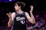 Mar 11, 2026; Sacramento, California, USA; Sacramento Kings center Maxime Raynaud (42) questions a call against the Charlotte Hornets during the fourth quarter at Golden 1 Center. Mandatory Credit: Kelley L Cox-Imagn Images