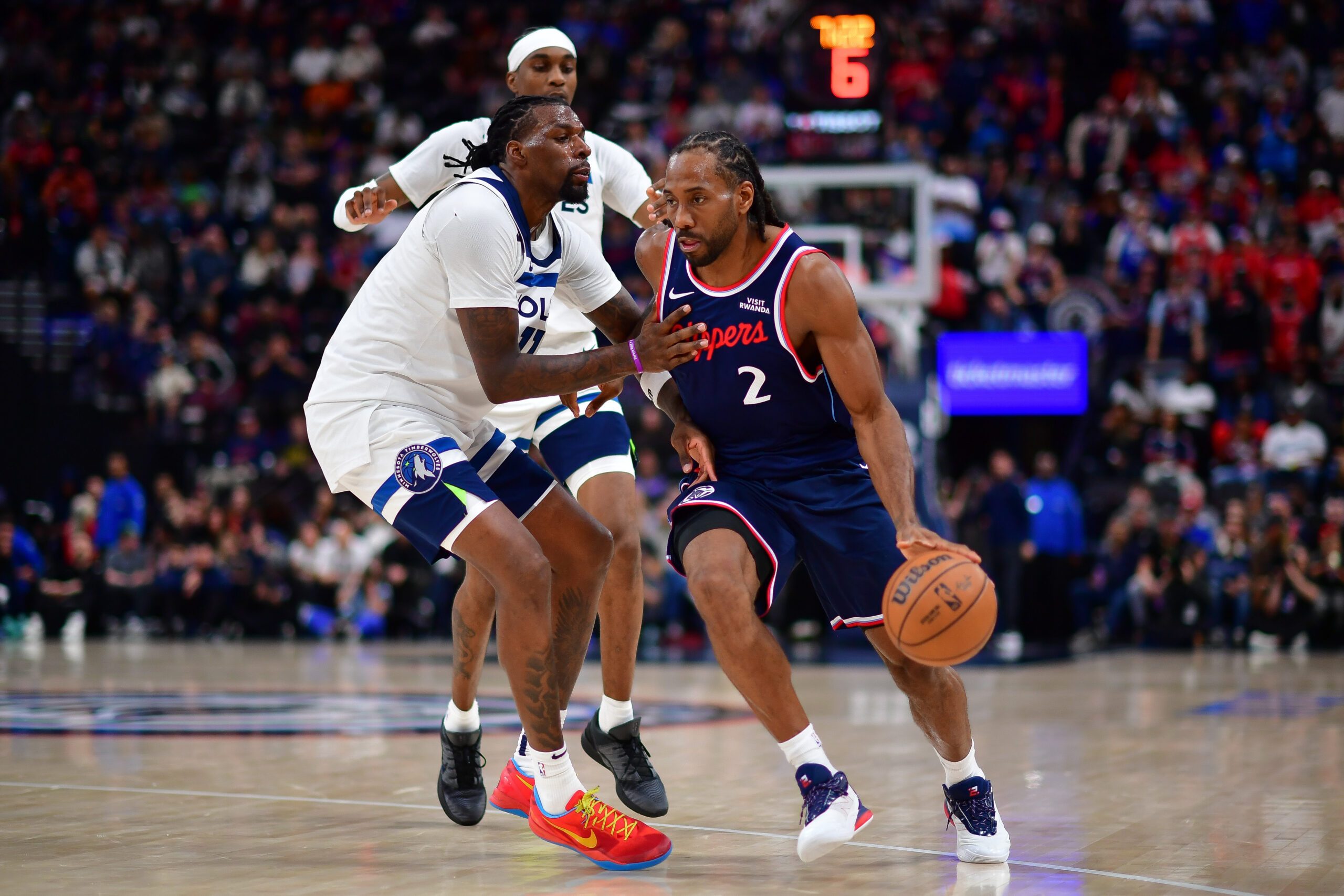 Mar 11, 2026; Inglewood, California, USA; Los Angeles Clippers forward Kawhi Leonard (2) moves the ball against Minnesota Timberwolves center Naz Reid (11) during the second half at Intuit Dome. Mandatory Credit: Gary A. Vasquez-Imagn Images