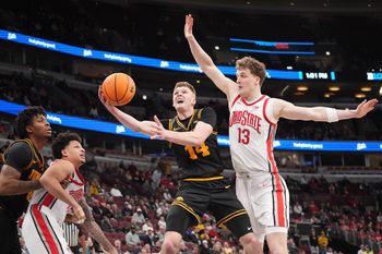 Mar 12, 2026; Chicago, IL, USA; Ohio State Buckeyes center Christoph Tilly (13) defends Iowa Hawkeyes guard Bennett Stirtz (14) during the second half at United Center. Mandatory Credit: David Banks-Imagn Images
