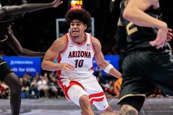 Mar 12, 2026; Kansas City, MO, USA; Arizona Wildcats forward Koa Peat (10) drives to the basket during the first half against the UCF Knights at T-Mobile Center. Mandatory Credit: William Purnell-Imagn Images