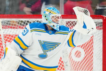 Mar 12, 2026; Raleigh, North Carolina, USA;  St. Louis Blues goaltender Jordan Binnington (50) looks at the puck in his glove during the warmups before the game against the Carolina Hurricanes at Lenovo Center. Mandatory Credit: James Guillory-Imagn Images