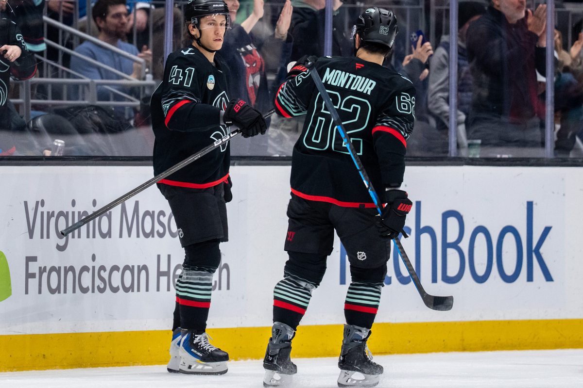 Mar 12, 2026; Seattle, Washington, USA; Seattle Kraken defenseman Ryker Evans (41) is congratulated by Seattle Kraken defenseman Brandon Montour (62) after scoring a goal during the second period against the Colorado Avalanche at Climate Pledge Arena. Mandatory Credit: Stephen Brashear-Imagn Images