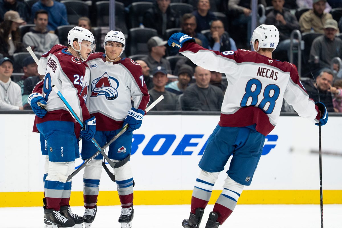 Mar 12, 2026; Seattle, Washington, USA; Colorado Avalanche, from left, forward Nathan MacKinnon (29) defenseman Sam Malinski (70) and forward Martin Necas (88) celebrate a goal during the second period against the Seattle Kraken at Climate Pledge Arena. Mandatory Credit: Stephen Brashear-Imagn Images