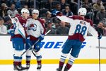 Mar 12, 2026; Seattle, Washington, USA; Colorado Avalanche, from left, forward Nathan MacKinnon (29) defenseman Sam Malinski (70) and forward Martin Necas (88) celebrate a goal during the second period against the Seattle Kraken at Climate Pledge Arena. Mandatory Credit: Stephen Brashear-Imagn Images