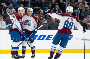 Mar 12, 2026; Seattle, Washington, USA; Colorado Avalanche, from left, forward Nathan MacKinnon (29) defenseman Sam Malinski (70) and forward Martin Necas (88) celebrate a goal during the second period against the Seattle Kraken at Climate Pledge Arena. Mandatory Credit: Stephen Brashear-Imagn Images