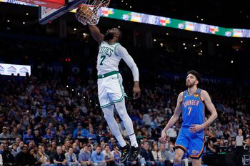 Mar 12, 2026; Oklahoma City, Oklahoma, USA; Boston Celtics guard/forward Jaylen Brown (7) goes up for a dunk in front of Oklahoma City Thunder center/forward Chet Holmgren (7) during the fourth quarter at Paycom Center. Mandatory Credit: Alonzo Adams-Imagn Images